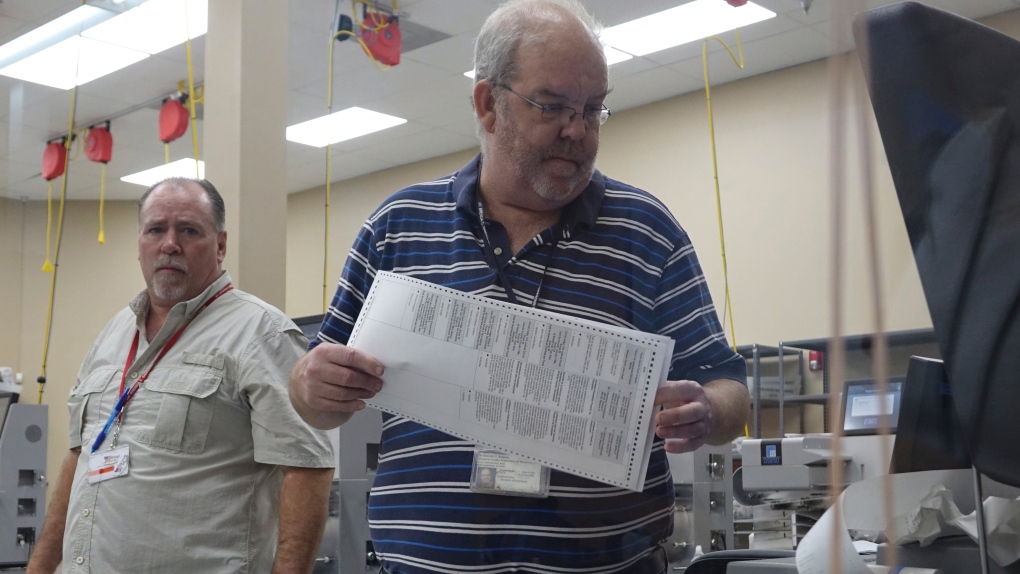 Election workers recount ballots