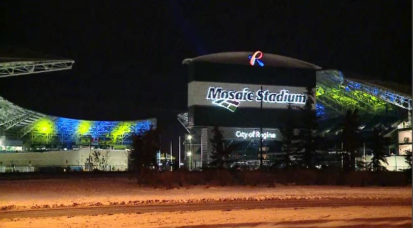 Mosaic Stadium lit up blue and gold
