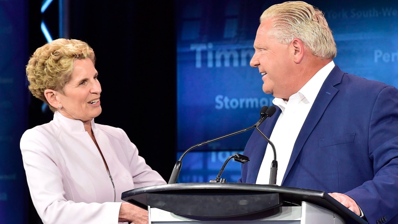 Former Ontario Liberal Leader Kathleen Wynne, left, and Ontario Progressive Conservative Leader Doug Ford shake hands following the end of the third and final televised debate of the provincial election campaign in Toronto, Sunday, May 27, 2018. (THE CANADIAN PRESS/Frank Gunn)