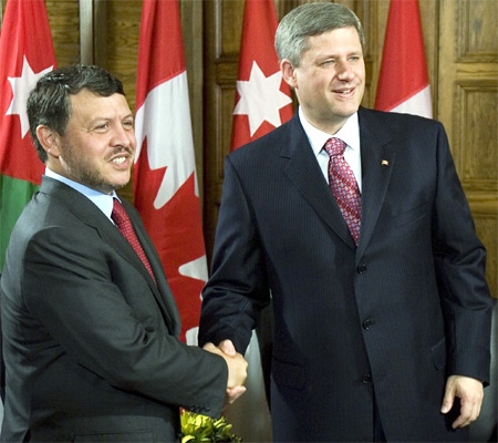 King Abdullah of Jordan and Prime Minister Stephen Harper shake hands prior to their meeting on Parliament Hill in Ottawa on Friday, July 13, 2007. (CP / Tom Hanson)