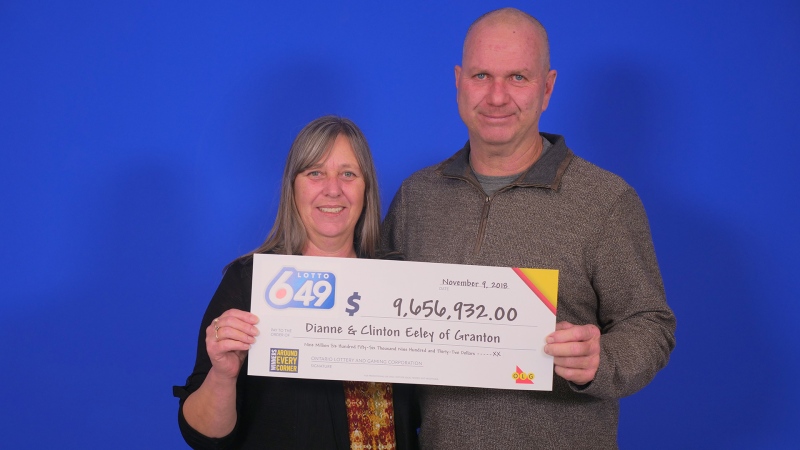 After winning the Nov. 3 Lotto 6/49 drawy, Dianne and Clinton Eeley of Granton, Ont. hold up their cheque in Toronto, Ont. on Thursday, Nov. 15, 2018. (Source: OLG)