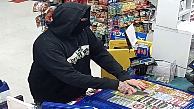 A masked suspect holding a knife