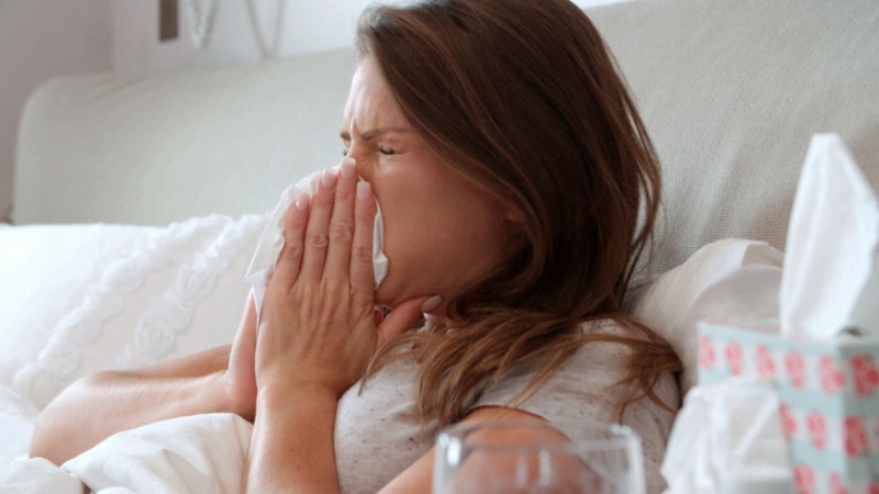 A woman is seen blowing her nose in this file photo. (Pexels)