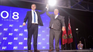 Federal Conservative Leader Andrew Scheer, left, is joined on stage by Ontario Premier Doug Ford after addressing the Ontario PC Convention in Toronto on Saturday, November 17, 2018. THE CANADIAN PRESS/Chris Young