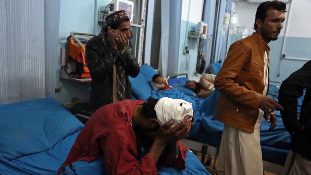 Injured men receive treatment in Kabul