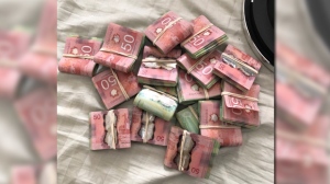 During one raid police said they found a significant amount of money hidden in the walls, which police allege is the proceeds of crime. (Supplied).