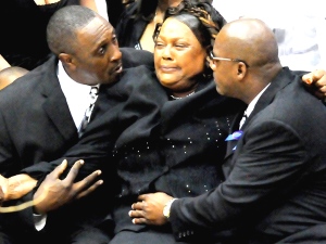 The family of Steve McNair, including his brother, Fred McNair, right, his  mother, Lucille McNair, second from right, and his wife, Mechelle McNair,  left, attend the funeral service for Steve McNair in