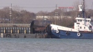A Canadian barge carrying steel coil crashed into a dock along the Detroit River. (CTV Windsor)