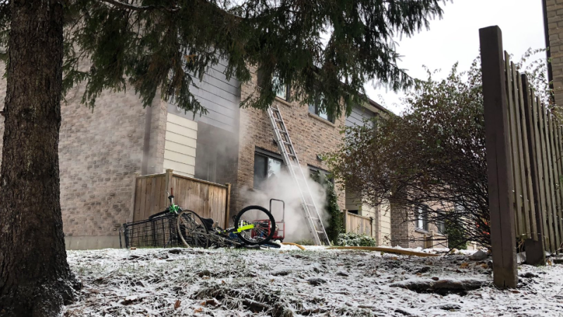 Fire hit a townhouse on Summit Avenue in London Ont. on Tuesday, Nov. 27, 2018. (Justin Zadorsky / CTV London)
