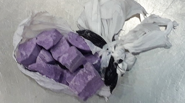 Purple cubes in a bag identified as fentanyl