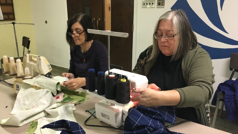 Members of the local chapter of the Canadian Embroiderers' Guild make drainage bags for women with breast cancer in London, Ont. on Thursday, Nov. 29, 2018. (Celine Moreau / CTV London) 