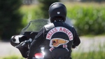A member of the Hells Angels arrives for a national gathering in Saint-Charles-sur-Richelieu, Que., Friday, August 10, 2018.THE CANADIAN PRESS/Graham Hughes