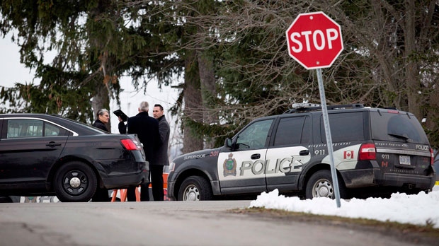 Niagara Regional Police, OPP and the SIU attend a scene near Effingham Street and Roland Road in Pelham, Ont., where a Niagara Regional Police officer was shot by a fellow officer, Thursday, Nov. 29, 2018. (THE CANADIAN PRESS/Aaron Lynett)