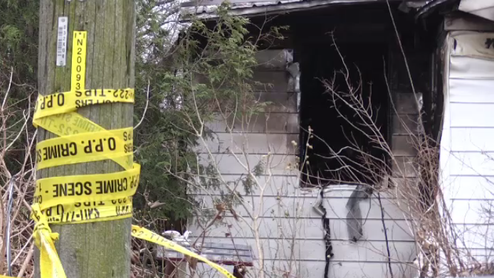 OPP crime scene tape, aftermath of a house fire