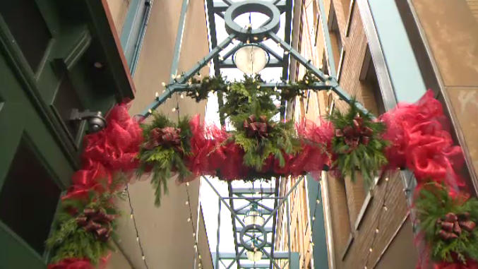 A laneway decorated with Christmas fare