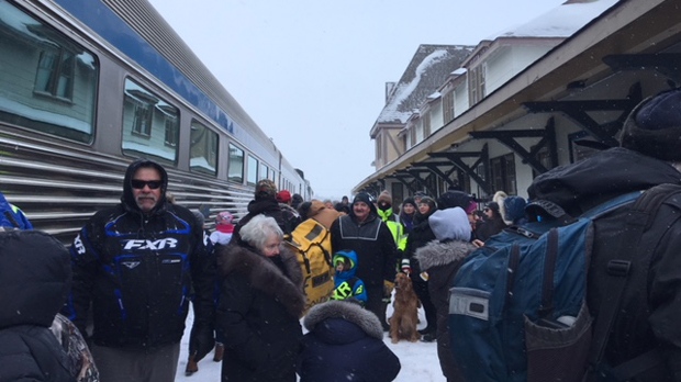 A crowd greets train passengers in Churchill