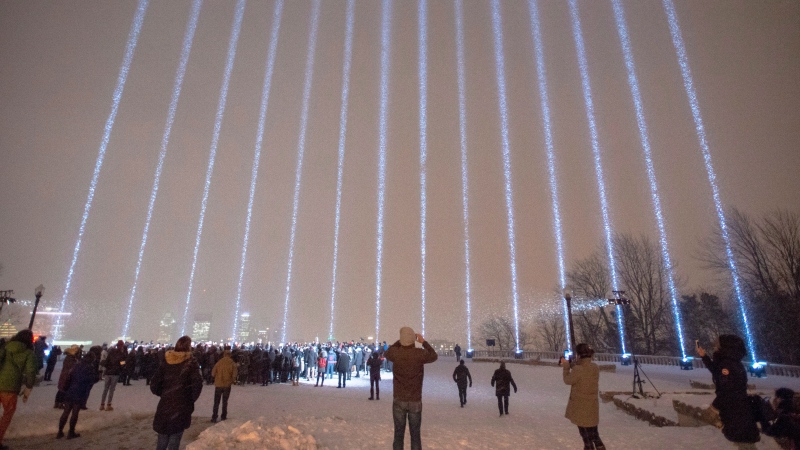Fourteen lights shine skyward at a vigil honouring the victims of the 1989 Ecole Polytechnique attack in Montreal.THE CANADIAN PRESS/Ryan Remiorz