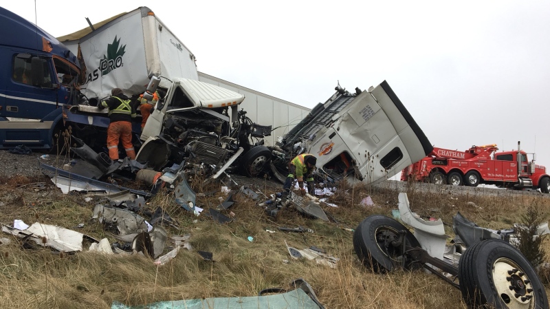 Debris is spread along the side of the road and in the westbound lanes of Highway 401 near Merlin Road in Chatham-Kent on Tuesday, Dec. 11, 2018. (Ricardo Veneza / CTV Windsor)