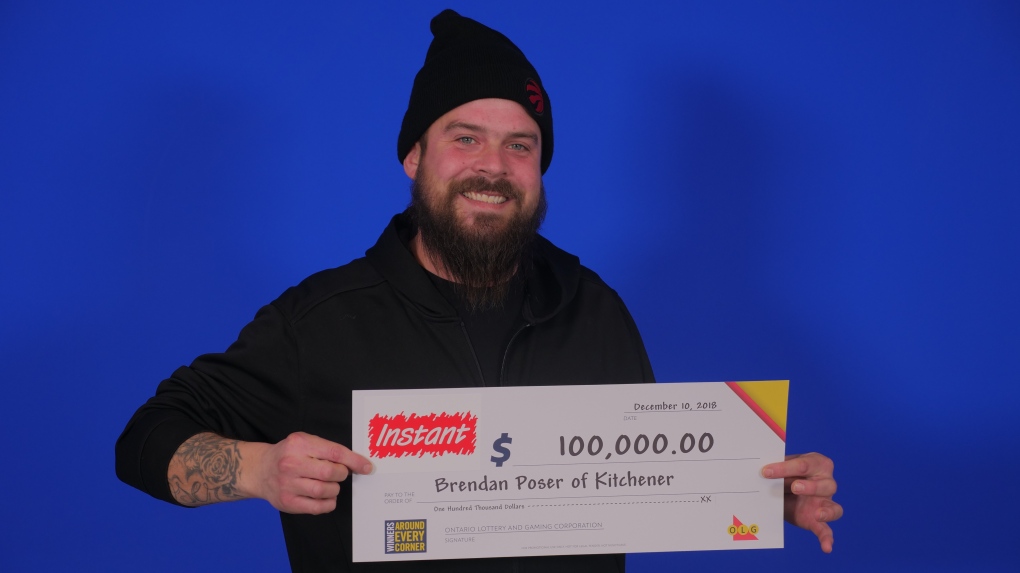 Brendan Poser poses with a $100,000 cheque