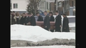 ARCHIVAL FOOTAGE: From outside the 1998 funeral of Renee Sweeney.