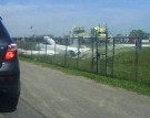A small jet sits in a ditch shorlty after takeoff at CFB Trenton, Wednesday, July 15, 2009. Chris Barber/MyNews.CTV.ca