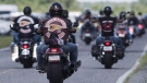 Members of the Hells Angels arrive for a national gathering in Saint-Charles-sur-Richelieu, Que., on Friday, August 10, 2018. THE CANADIAN PRESS/Graham Hughes