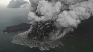 This aerial shot taken on Sunday, Dec. 23, 2018 shows Mount Anak Krakatau as it erupts on Java Strait, Indonesia. (Nurul Hidayat/Bisnis Indonesia via AP)