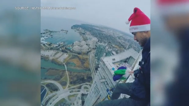 A man is seen in this video posted to social media jumping off the top of an unfinished condo building in Toronto. (Instagram/@pinnedwideopen)