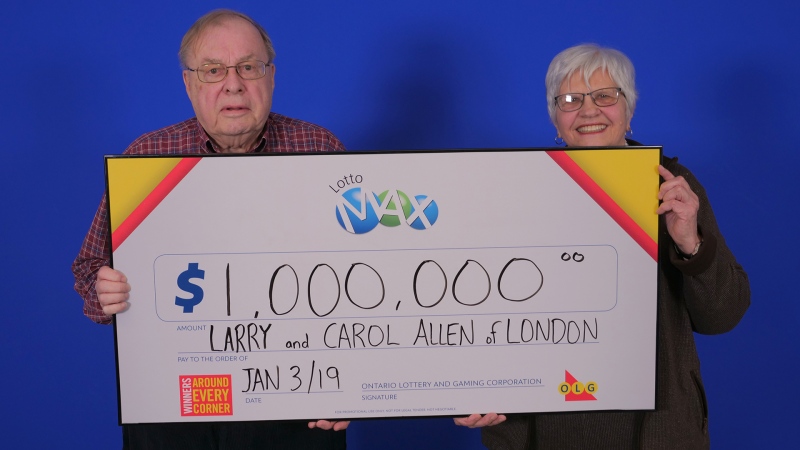 Larry and Carol Allen of London, Ont. hold up their $1-million cheque.