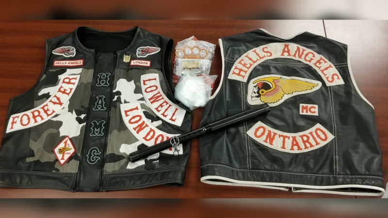 Two Hell's Angels vests, cocaine and brass knuckles seized during searches in London, Ont. on Saturday, Jan. 5, 2018 are seen in this image released by OPP.