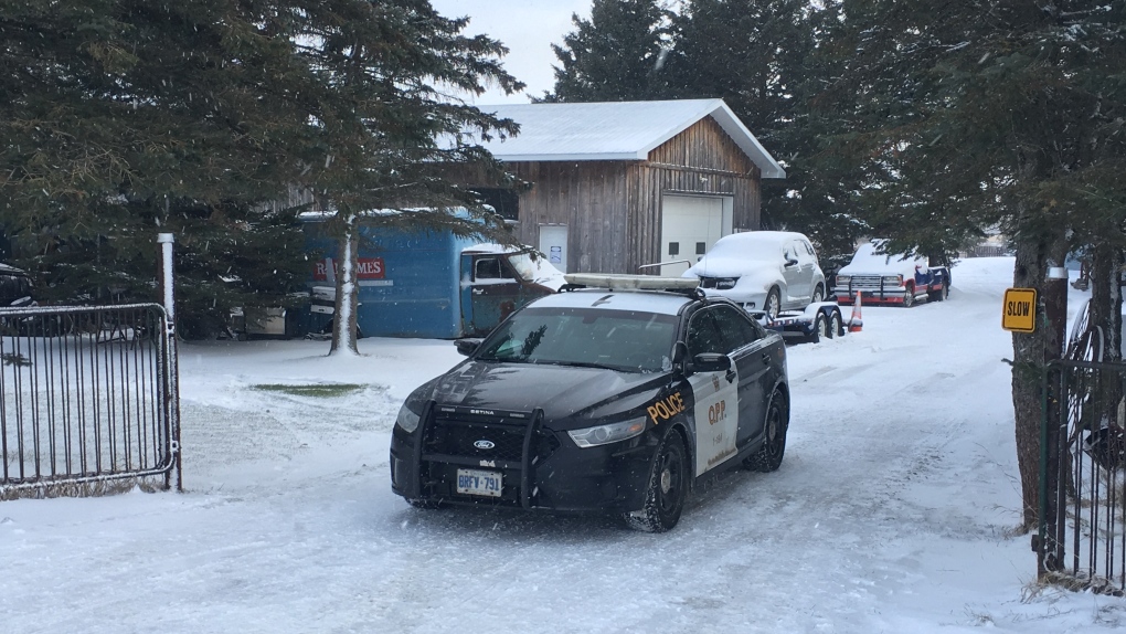 A police cruiser in a snowy driveway