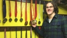 Gordie Michie shows off some of his 182 career swimming medals in St. Thomas, Ont. on Tuesday, Jan. 15, 2019. (Brent Lale / CTV London)