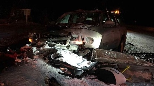 Two-vehicle crash involving snowmobile and truck