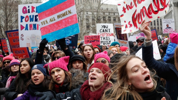 Participants at the Women's March NYC, a rally at Foley Square in Lower Manhattan react as loud music is played between speakers, Saturday, Jan. 19, 2019, in New York. (AP Photo/Kathy Willens)