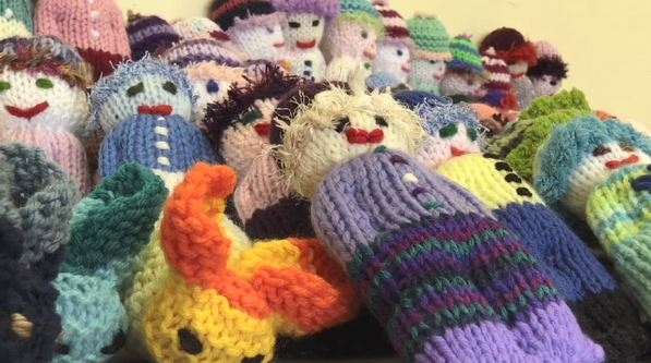 Seniors group makes knitted comfort dolls