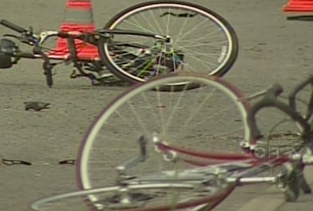 Bikes lay mangled on March Road in Kanata after a van plowed into a group of cyclists, Sunday, July 19, 2009.