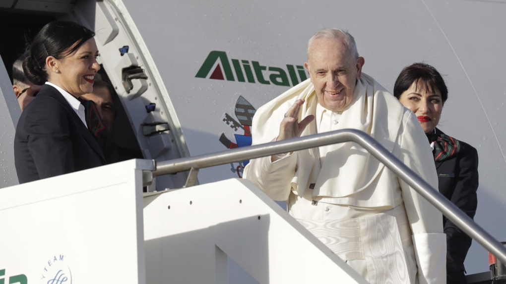 Pope Francis boards an airplane