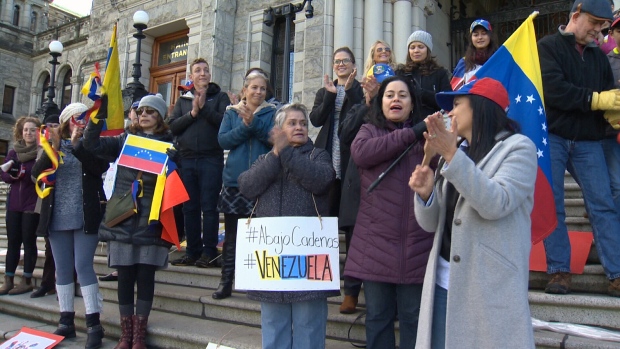 Supporters of Venzuela's new self-declared president Juan Guaido rallied on the steps of the B.C. Legislature in Victoria Wednesday, Jan. 23, 2019.  