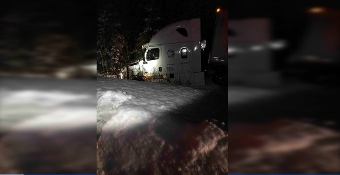 Transport truck in ditch overnight on Highway 11