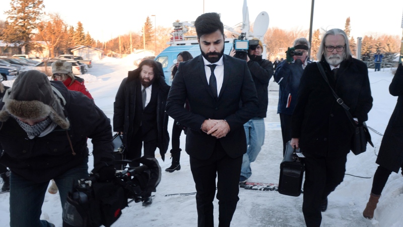 Jaskirat Singh Sidhu, centre, the driver of the truck that struck the bus carrying the Humboldt Broncos hockey team and pleaded guilty this month to 16 counts of dangerous driving causing death and 13 counts of dangerous driving causing bodily harm, arrives at a sentencing hearing, Monday, January 28, 2019 in Melfort, Sask.THE CANADIAN PRESS/Ryan Remiorz