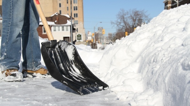 A Windsor resident shovelling after a snowfall