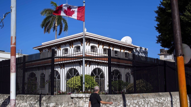 A man walks beside Canada's embassy in Havana, Cuba, Tuesday, April 17, 2018. THE CANADIAN PRESS/AP-Desmond Boylan