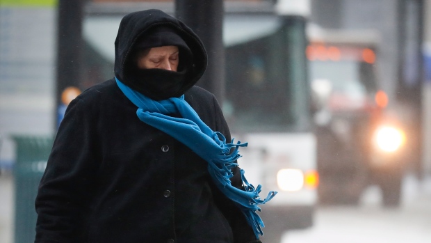 Commuters braves the wind and snow in frigid weather, Wednesday, Jan. 30, 2019, in Cincinnati. The extreme cold and record-breaking temperatures are crawling into a swath of states spanning from North Dakota to Missouri and into Ohio after a powerful snowstorm pounded the region earlier this week. (AP Photo/John Minchillo)