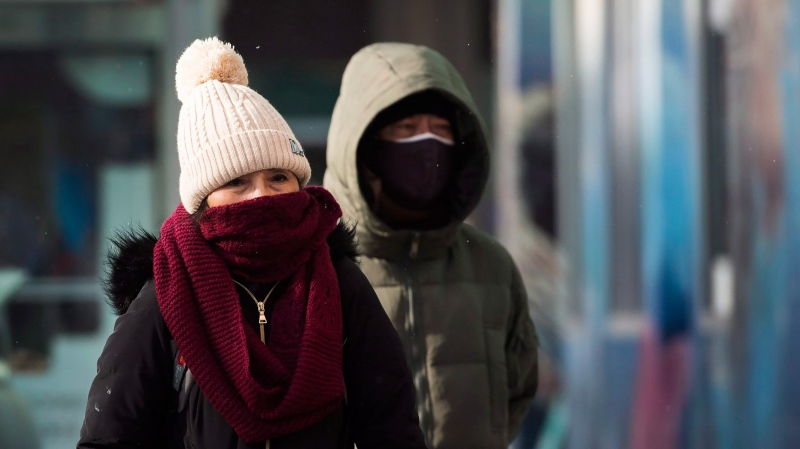 People walk in Chinatown during a cold and windy day in Toronto on Thursday, January 10, 2019. The city declared an extreme cold alert. THE CANADIAN PRESS/Nathan Denette