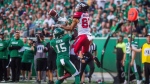 Saskatchewan Roughriders safety Mike Edem (15) tries to block a pass intended for Calgary Stampeders wide receiver Juwan Brescacin (82) during second half CFL action in Regina on Sunday, August 19, 2018. The Saskatchewan Roughriders defeated the Calgary Stampeders 40-27. (THE CANADIAN PRESS/Matt Smith)