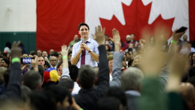 Canadian Prime Minister Justin Trudeau looks to the crowd as he takes questions at a town hall event in Milton, Ont. on Thursday, Jan. 31, 2019. THE CANADIAN PRESS/Cole Burston