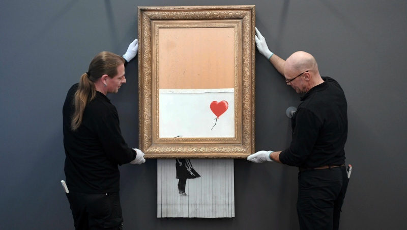 The shredded Banksy painting "Love is in the Bin 'is being exhibited at the Museum Frieder Burda in Baden-Baden Monday Feb. 4, 2019, where the work will be shown from Feb. 5 to March 3, 2019. It was originally titled 'Girl with Balloon' and since it destroyed itself during an art auction in London, it's called 'Love is in the Bin'.