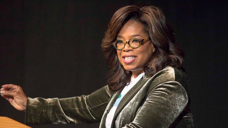 Oprah Winfrey speaks to a crowd during a town hall conversation for gubernatorial candidate Stacey Abrams at the Cobb Civic Center's Jennie T. Anderson Theatre in Marietta, Ga., Thursday, Nov. 1, 2018. (Alyssa Pointer /Atlanta Journal-Constitution via AP)
