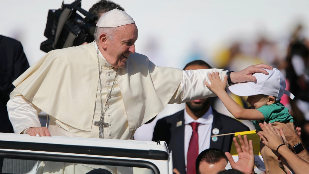 Pope Francis blesses a boy in Abu Dhabi
