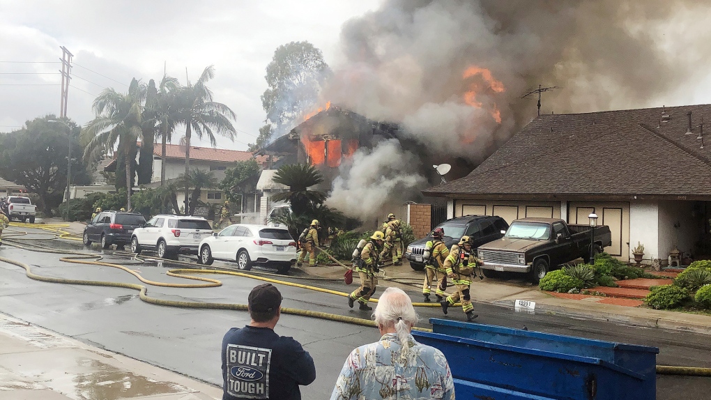 a home is engulfed in flames